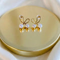 Gold Plated Wire Bow Stud Earrings with Faux Pearl Accents – Dainty Bow Pearl Earrings